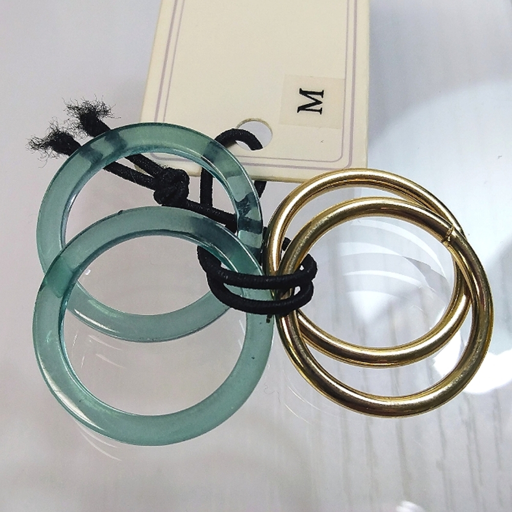 Rand Brothers set of 4 stack rings. Resin and brass. Multi sizes. NWT